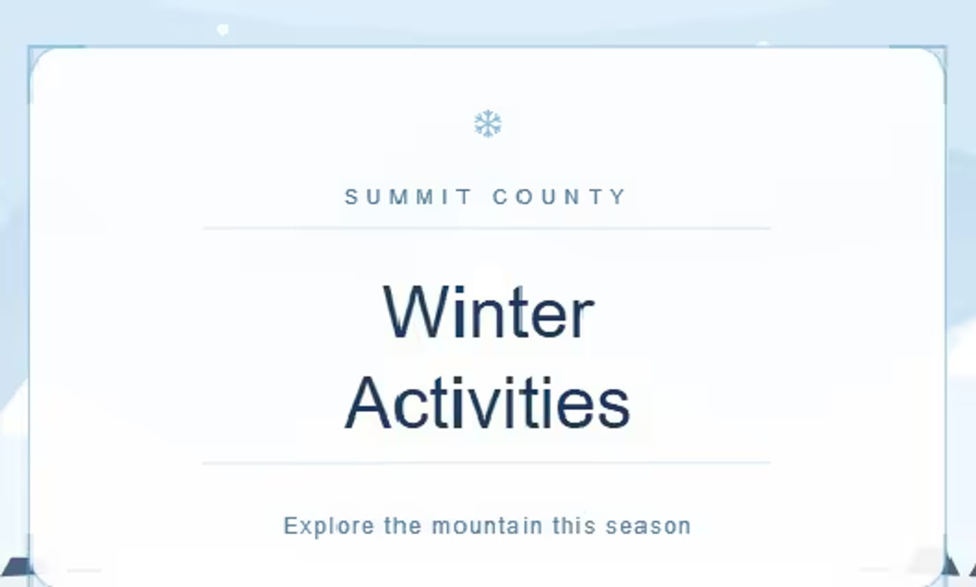 Snow-covered ski slopes and evergreens on an early-season morning